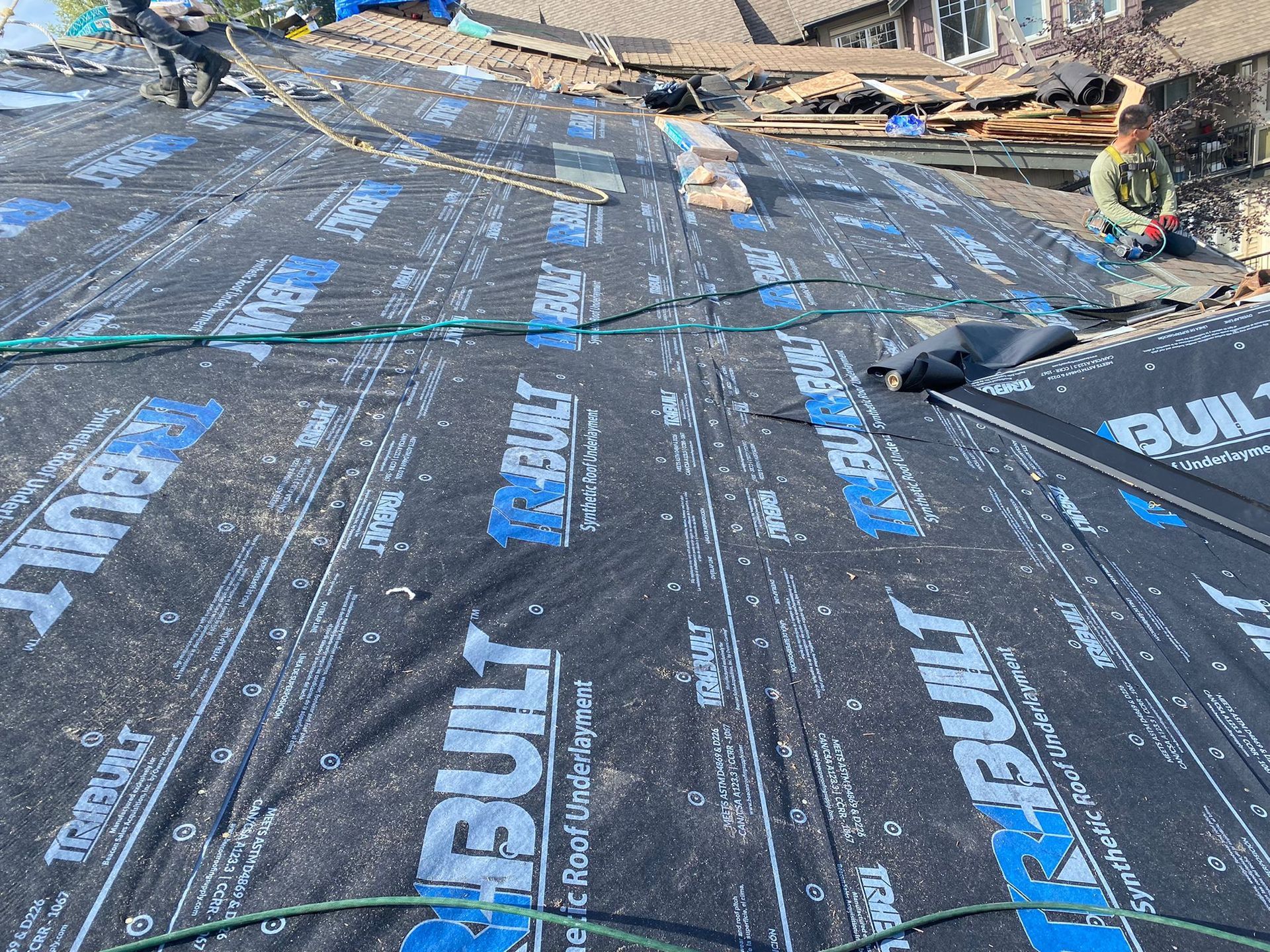 A roof with a lot of roofing material on it.