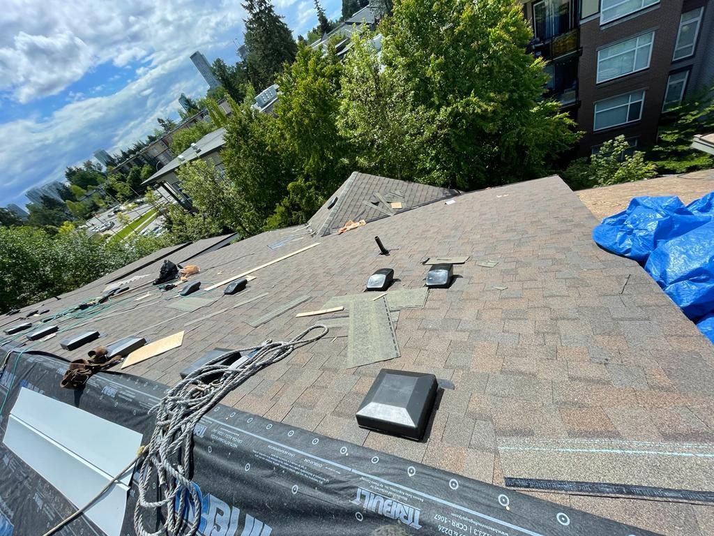 A roof is being repaired with a chain around it.