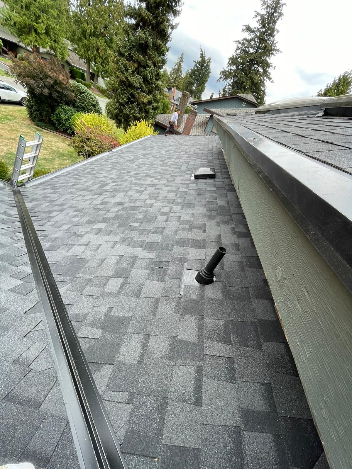A close up of a roof with a gutter on it.