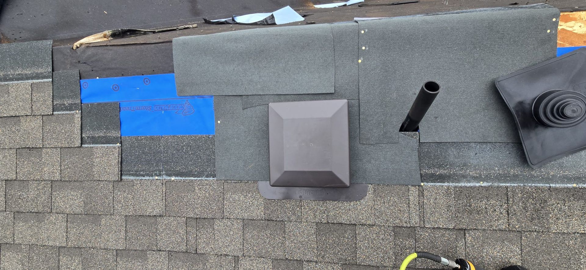 Box vent and plumbing stack set into ice and water shield over RoofNado StormTread XW underlayment during install, 229 St Maple Ridge BC, Paragon Roofing BC