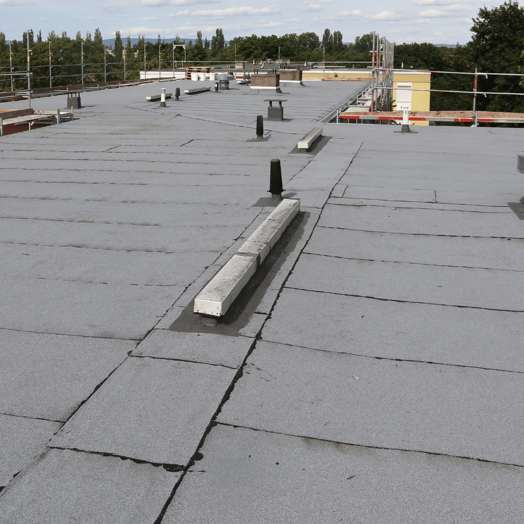The roof of a building with a gray roof