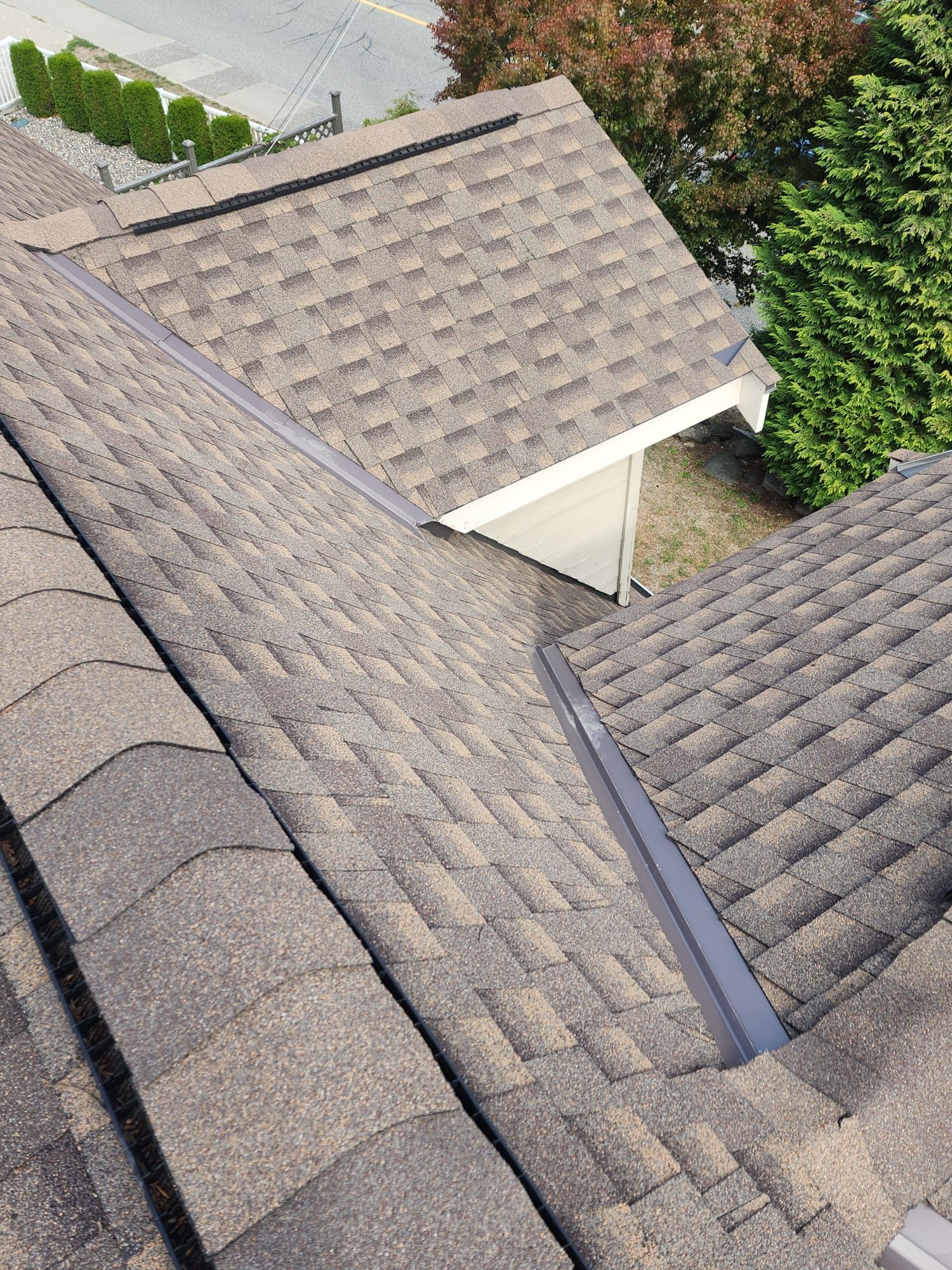 A close up of a roof with a gutter on it.