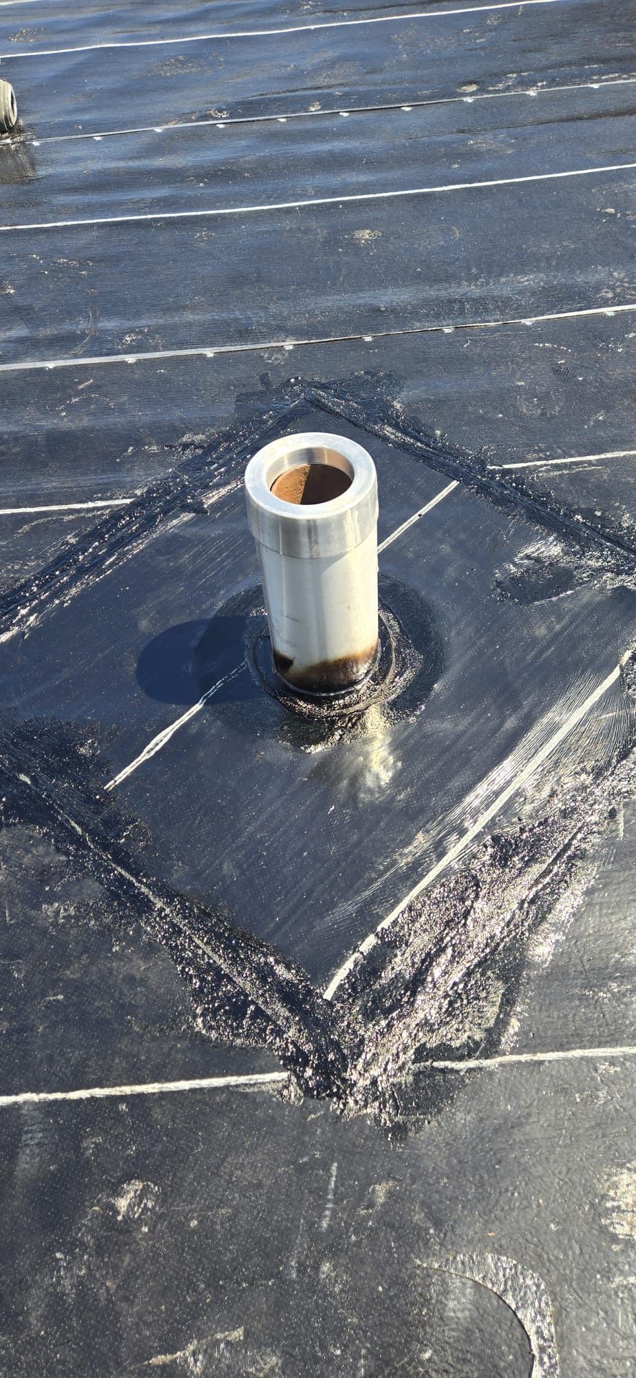 New vents and stacks sealed with torch applied flashing on New Westminster flat roof, Paragon Roofing BC