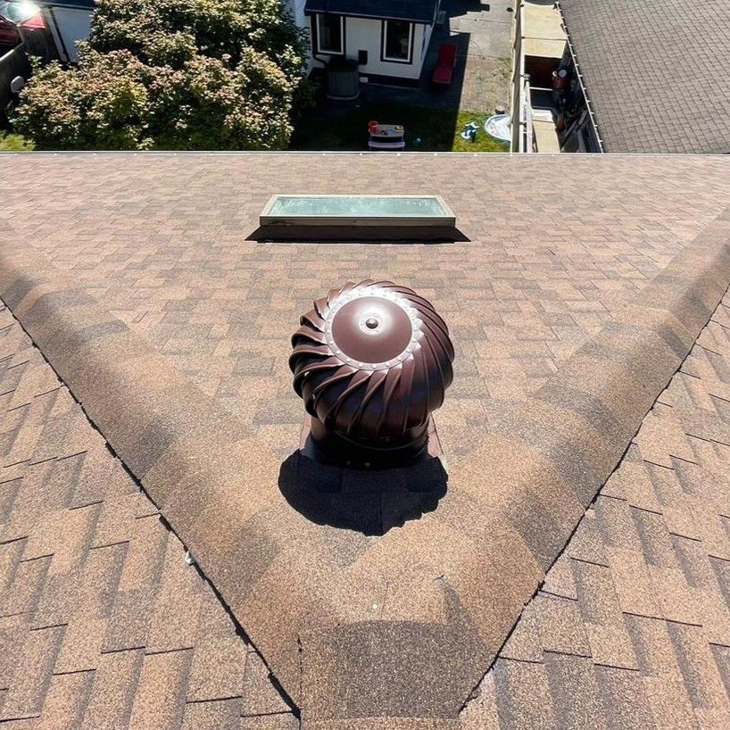 A brown roof with a circular object on top of it