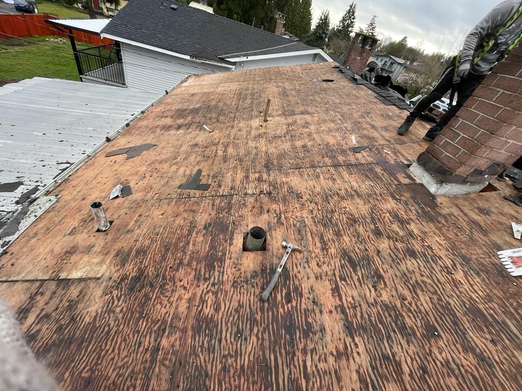 The roof of a house is being replaced with a new roof.