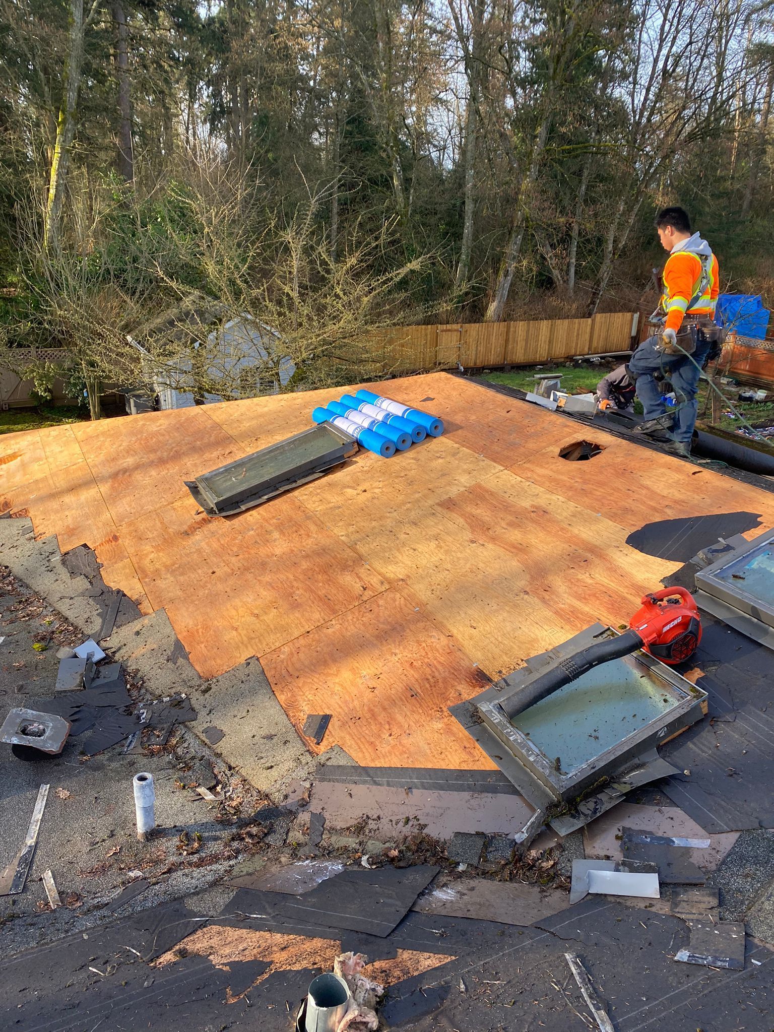 paragon roofers inspecting roof decking for damage