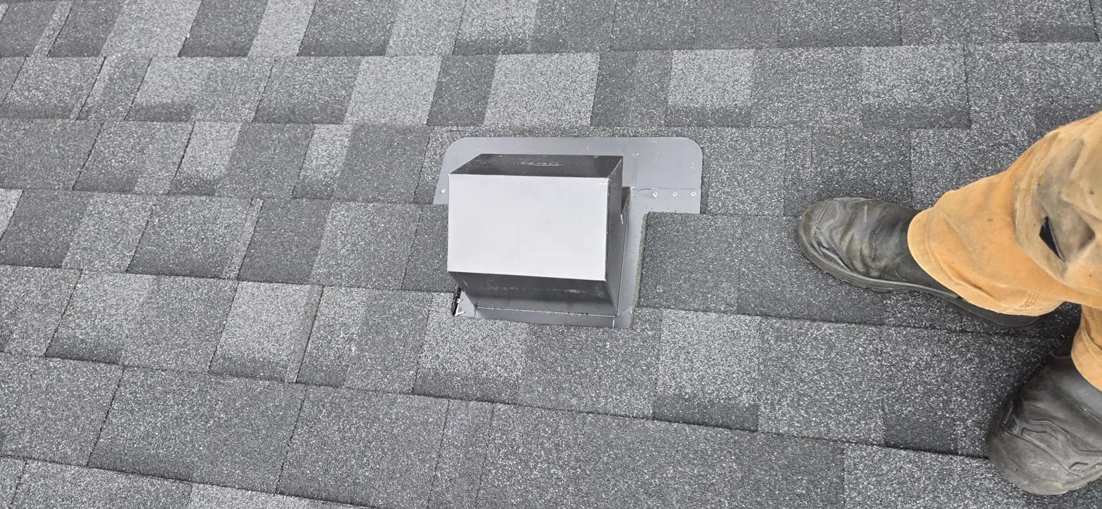 New gooseneck exhaust vent flashed into IKO Dynasty shingles on Thermal Drive Coquitlam roof, Paragon Roofing BC