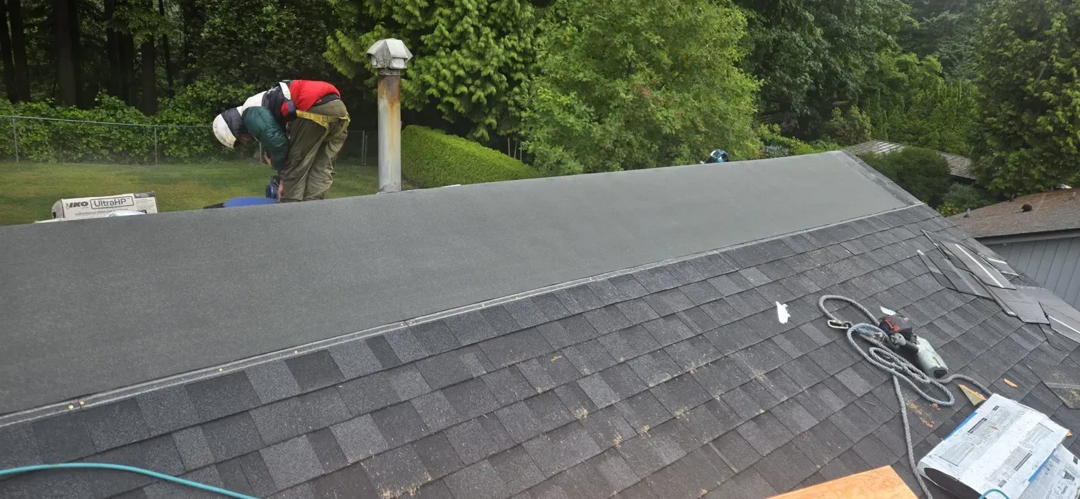 Vented ridge lines with IKO UltraHP caps on completed Thermal Drive Coquitlam roof, Paragon Roofing BC