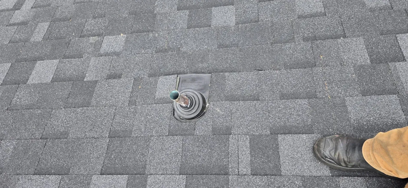 Second plumbing stack with new boot woven into IKO Dynasty shingles on Thermal Drive Coquitlam, Paragon Roofing BC