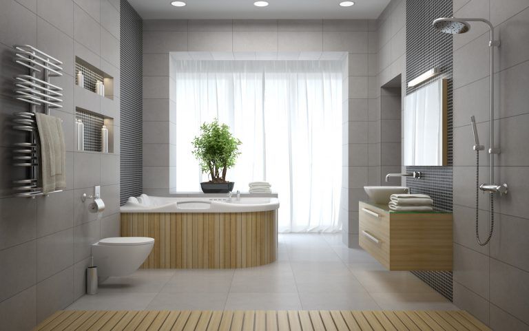 Modern bathroom with freestanding tub, glass shower, white tile, and a large window with sheer curtains in Glen Echo