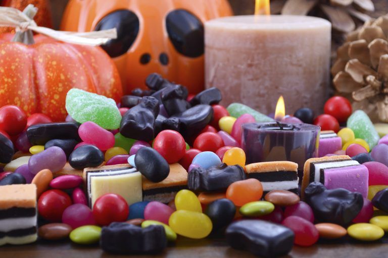Halloween candy and candles with pumpkins, a jack-o'-lantern, and autumn decorations in Rockville