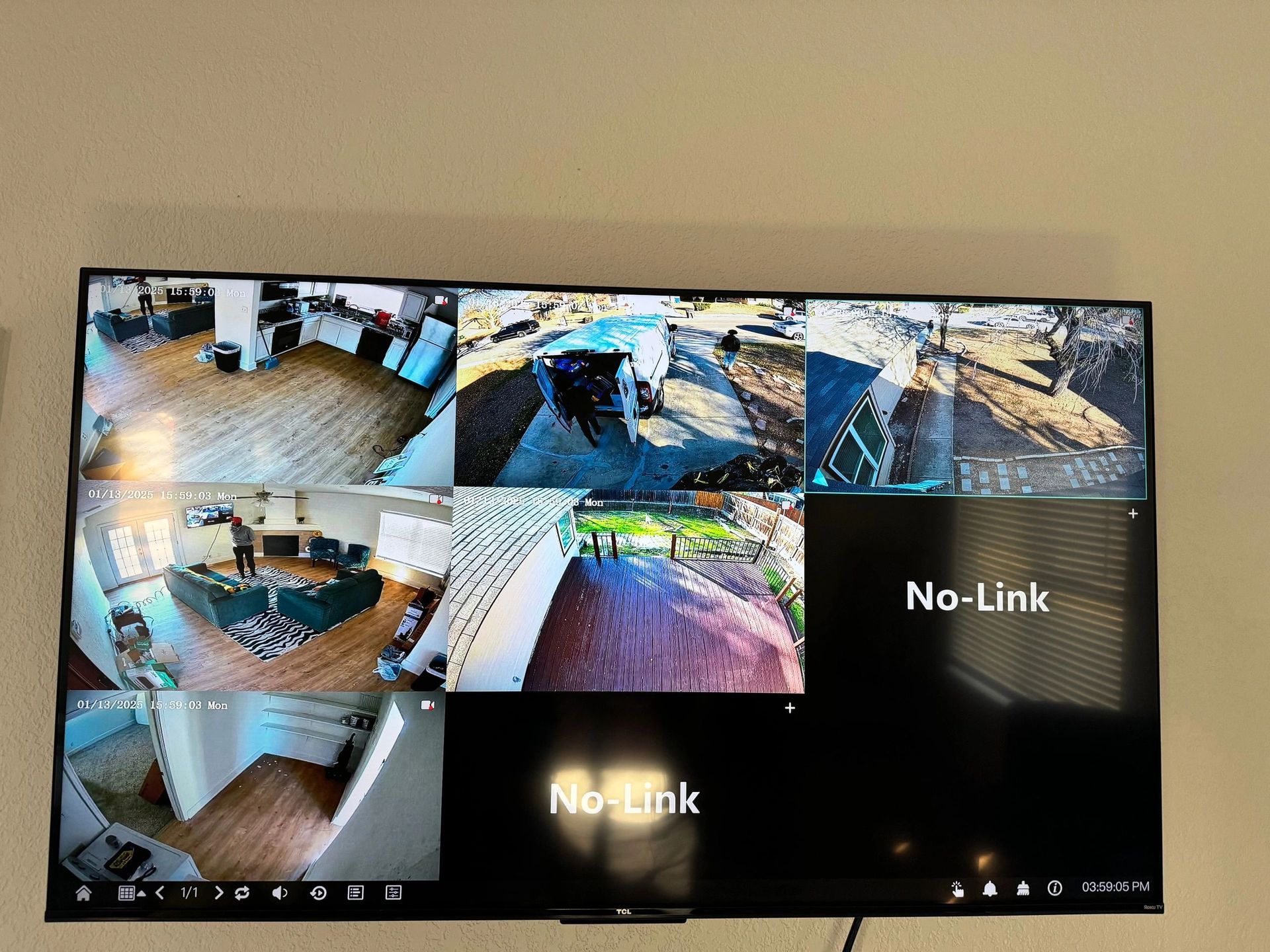 Security camera monitor showing multiple indoor and outdoor surveillance feeds, with two no-link black screens.