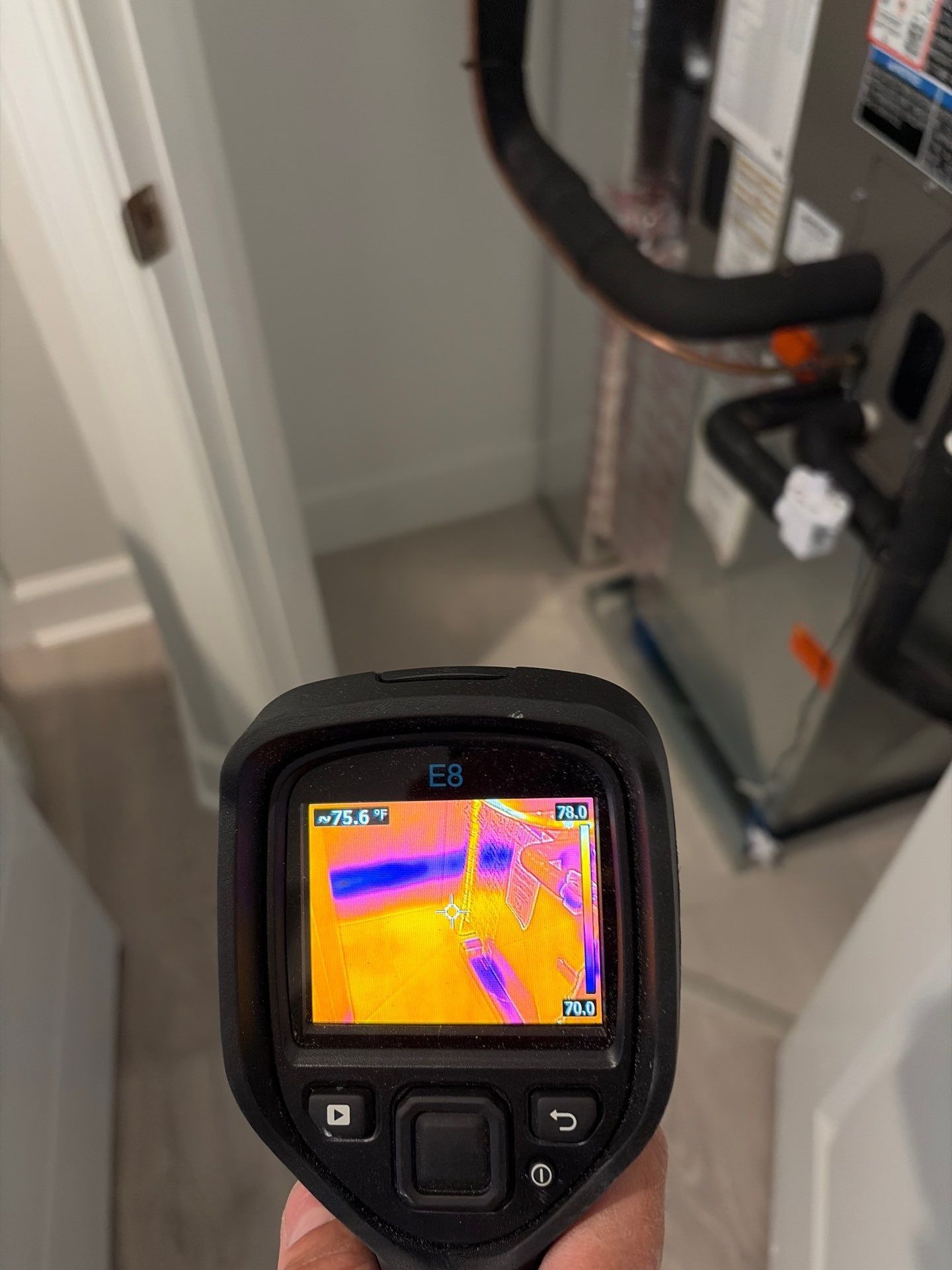 Thermal imaging inspection around an air handler for possible hidden moisture