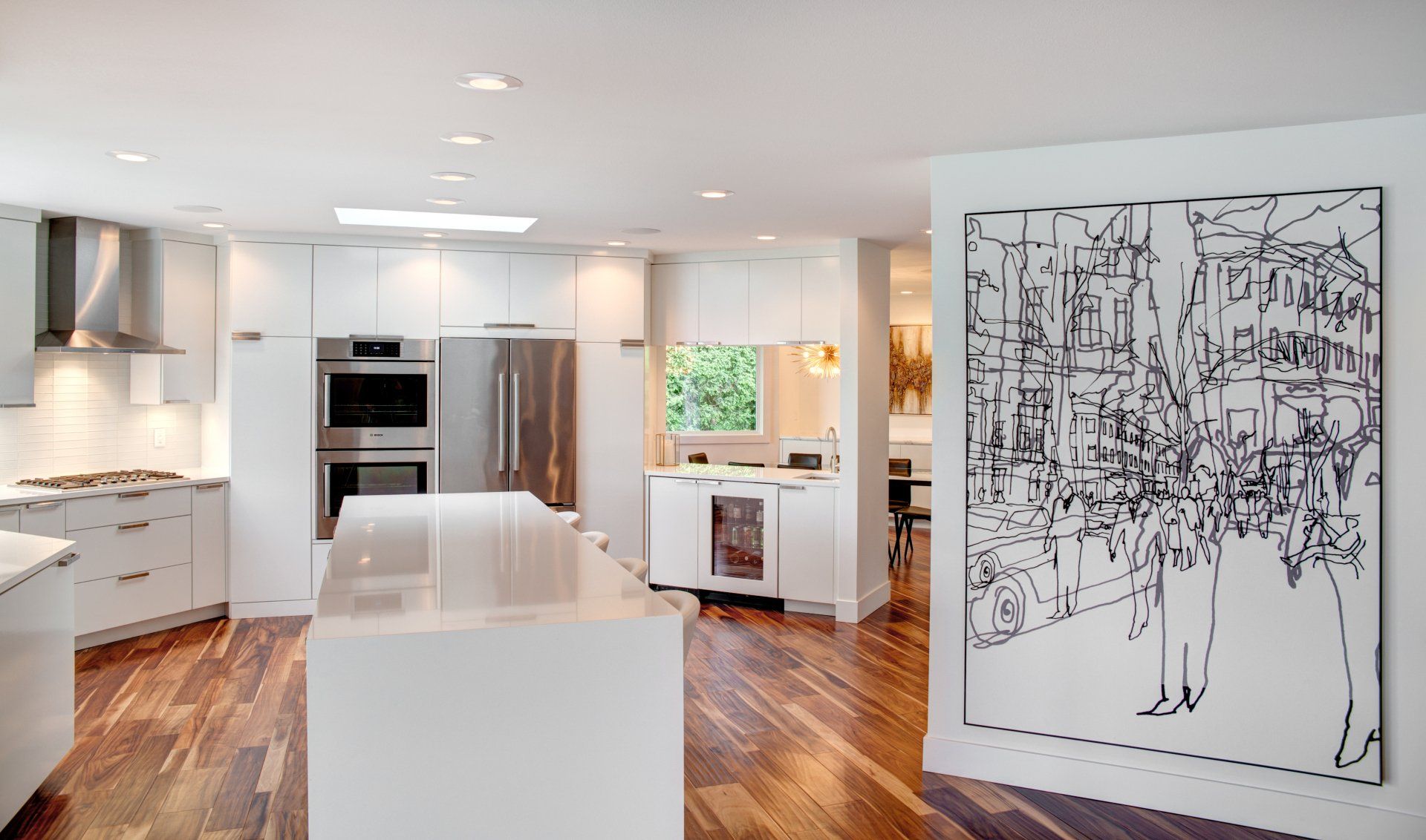 A kitchen with a stove top oven and a hood above it.
