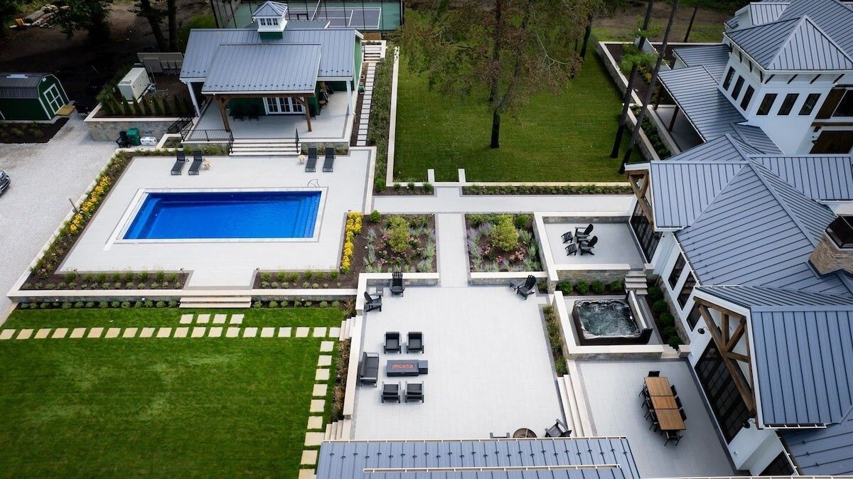 An outdoor kitchen with a pergola over it