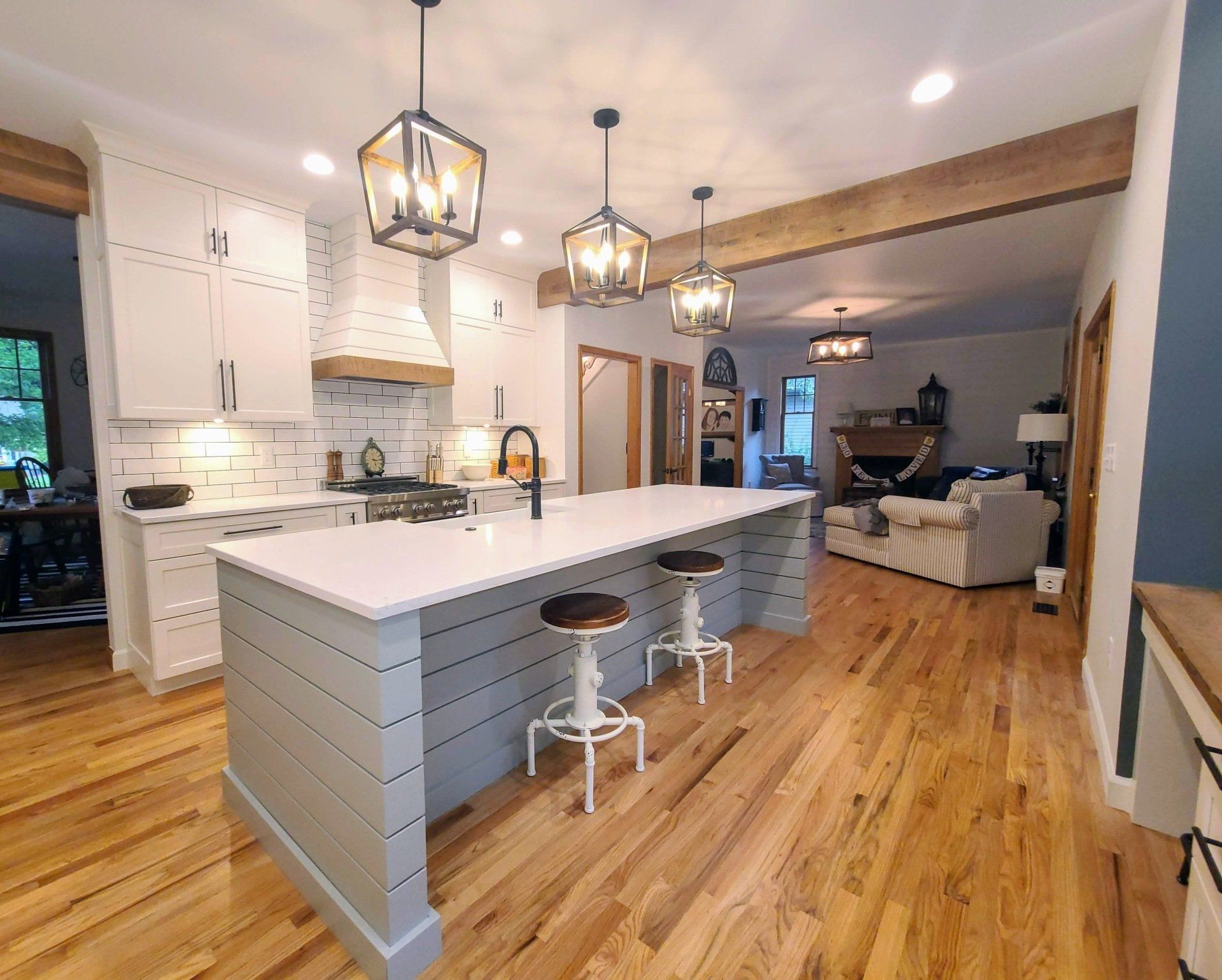 There is a large island in the middle of the kitchen.