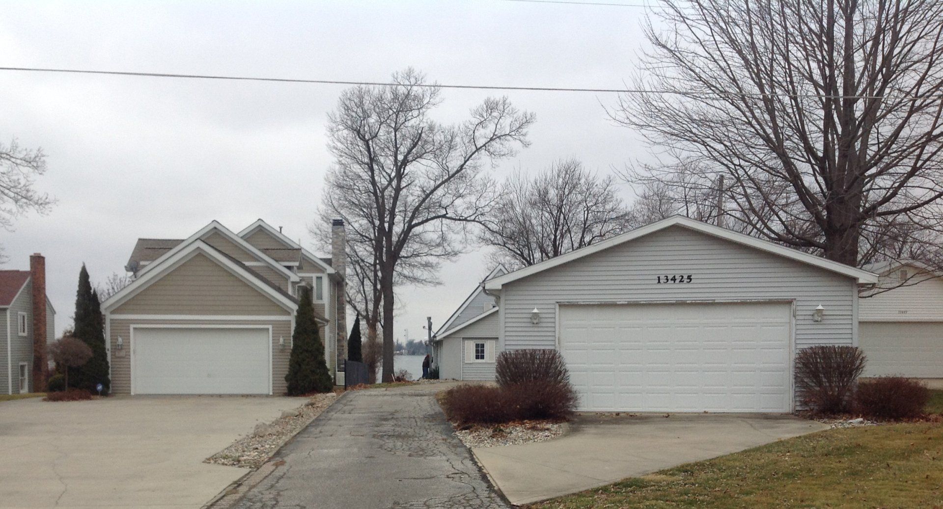 A couple of garages next to each other on a cloudy day