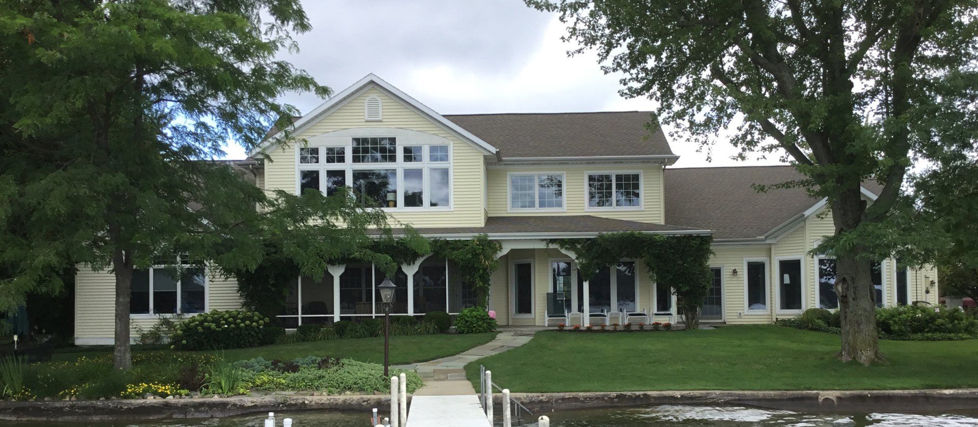 A large house with a dock in front of it