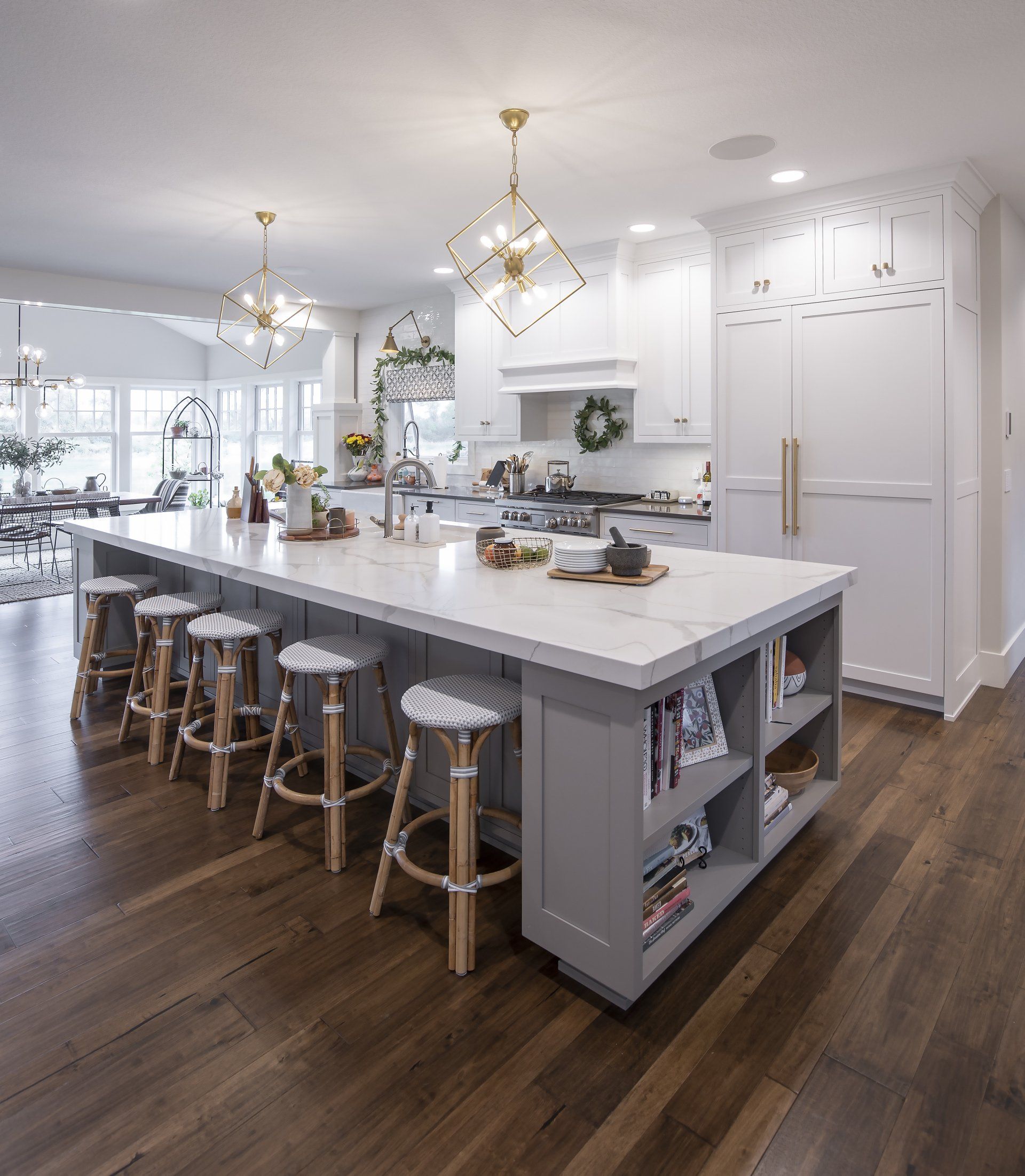 A kitchen with a large island and stools
