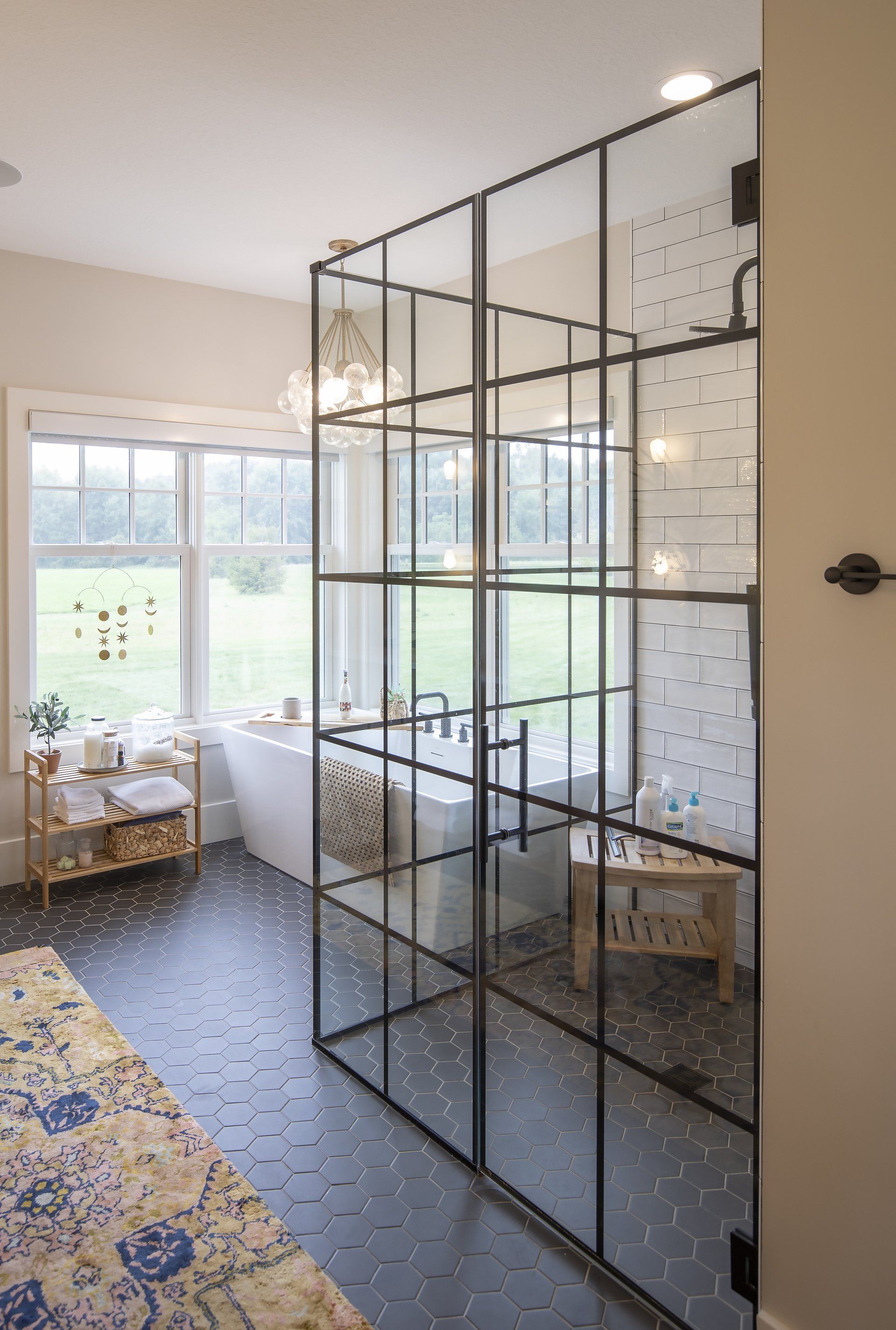 A bathroom with a bathtub and a walk in shower.