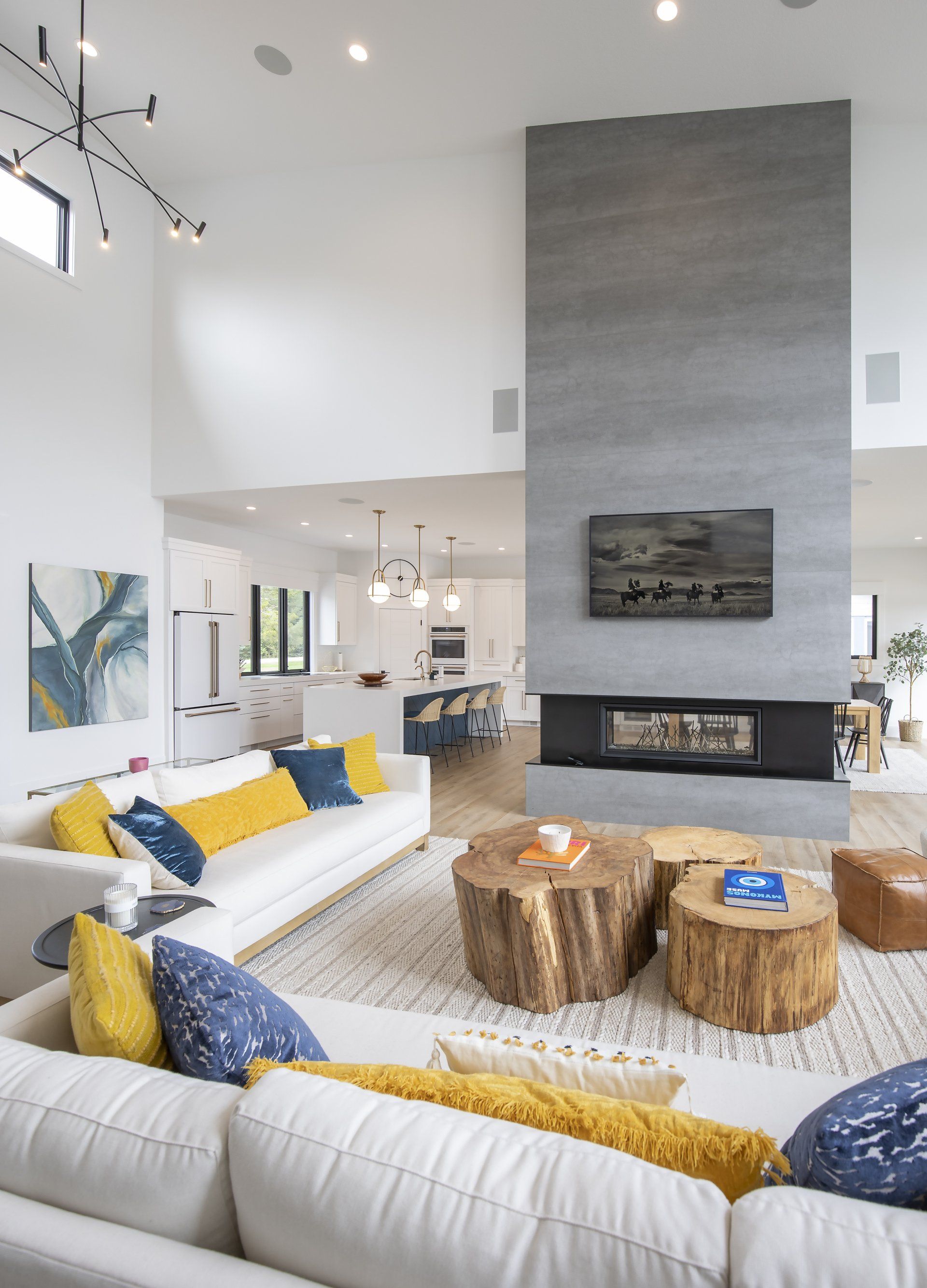 A living room with a white couch and a fireplace