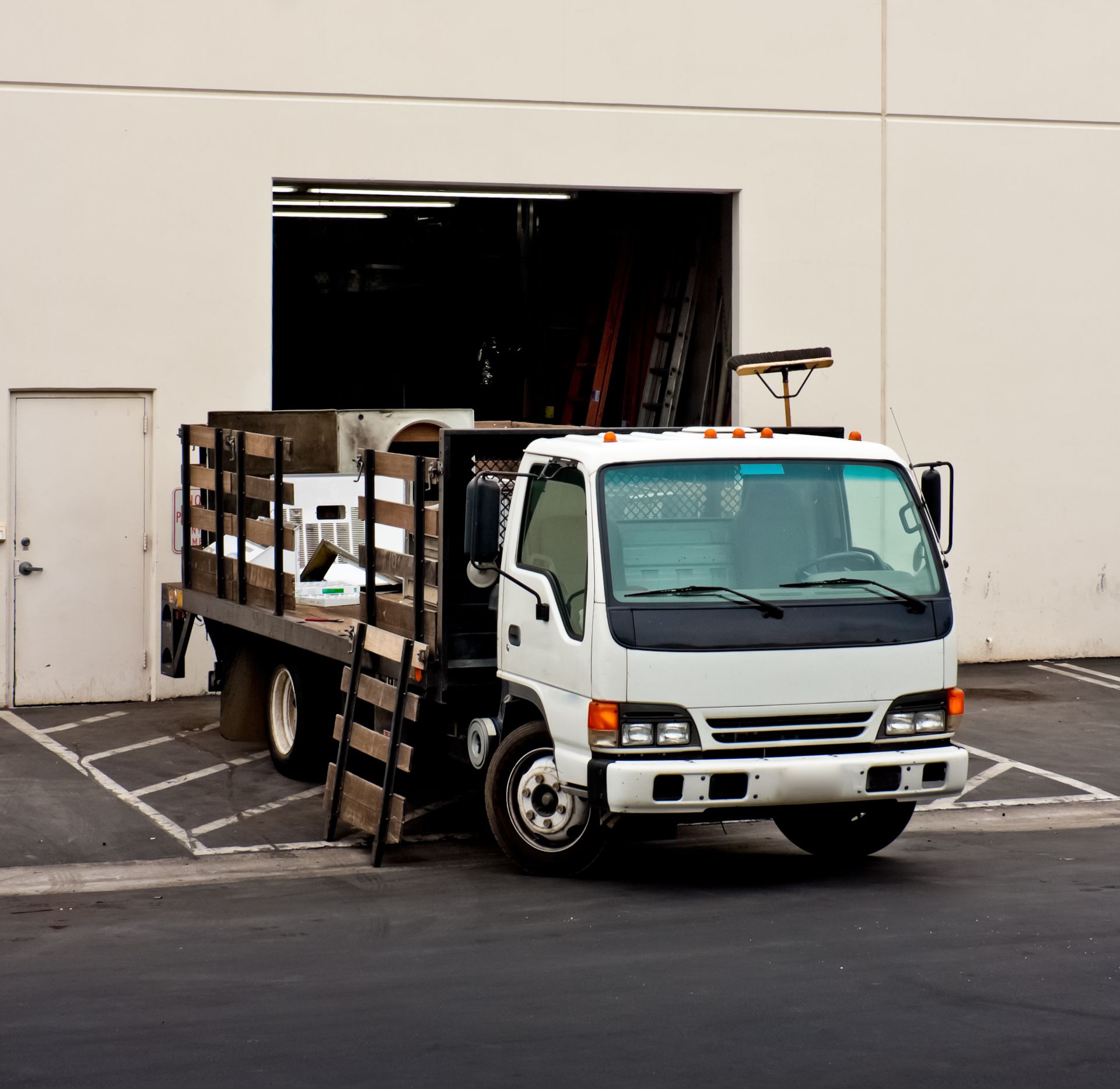 Cab truck showcasing stake beds, highlighting work-ready design and heavy-duty functionality.