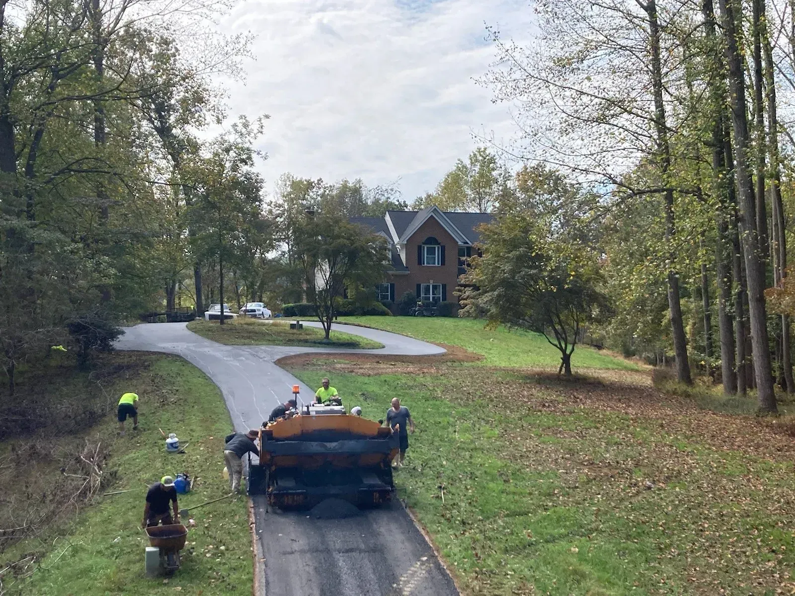ASPHALT BEING PAVED BY CREW