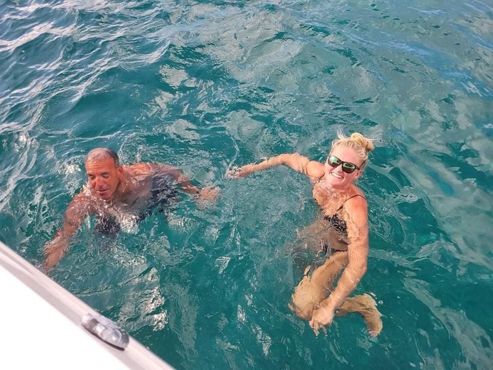 Top view of woman and man while swimming