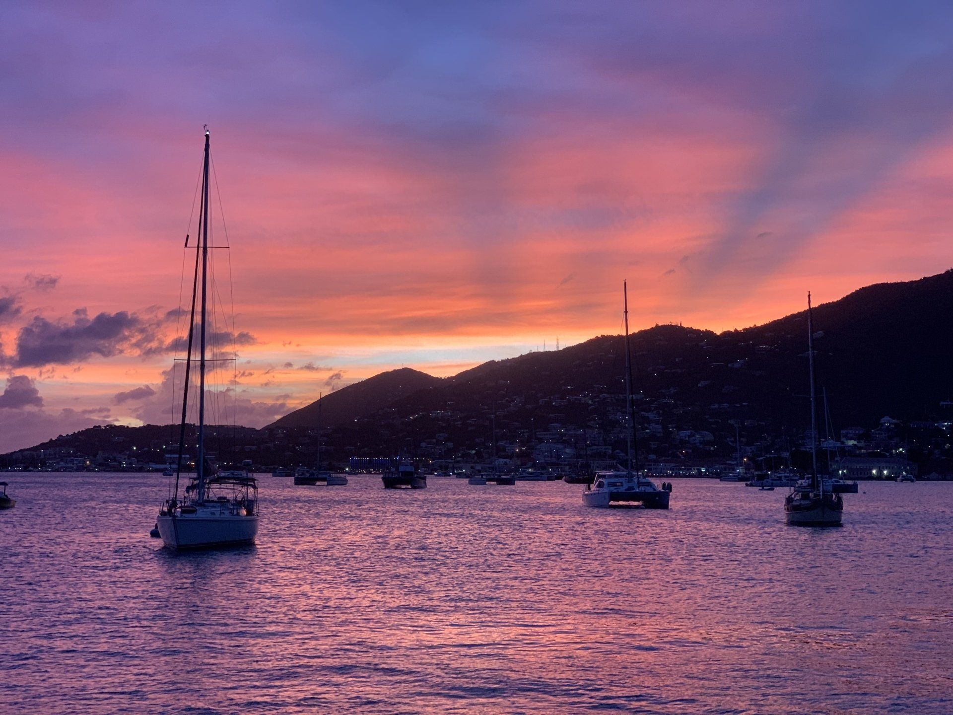 Sunset view in the ocean with boats
