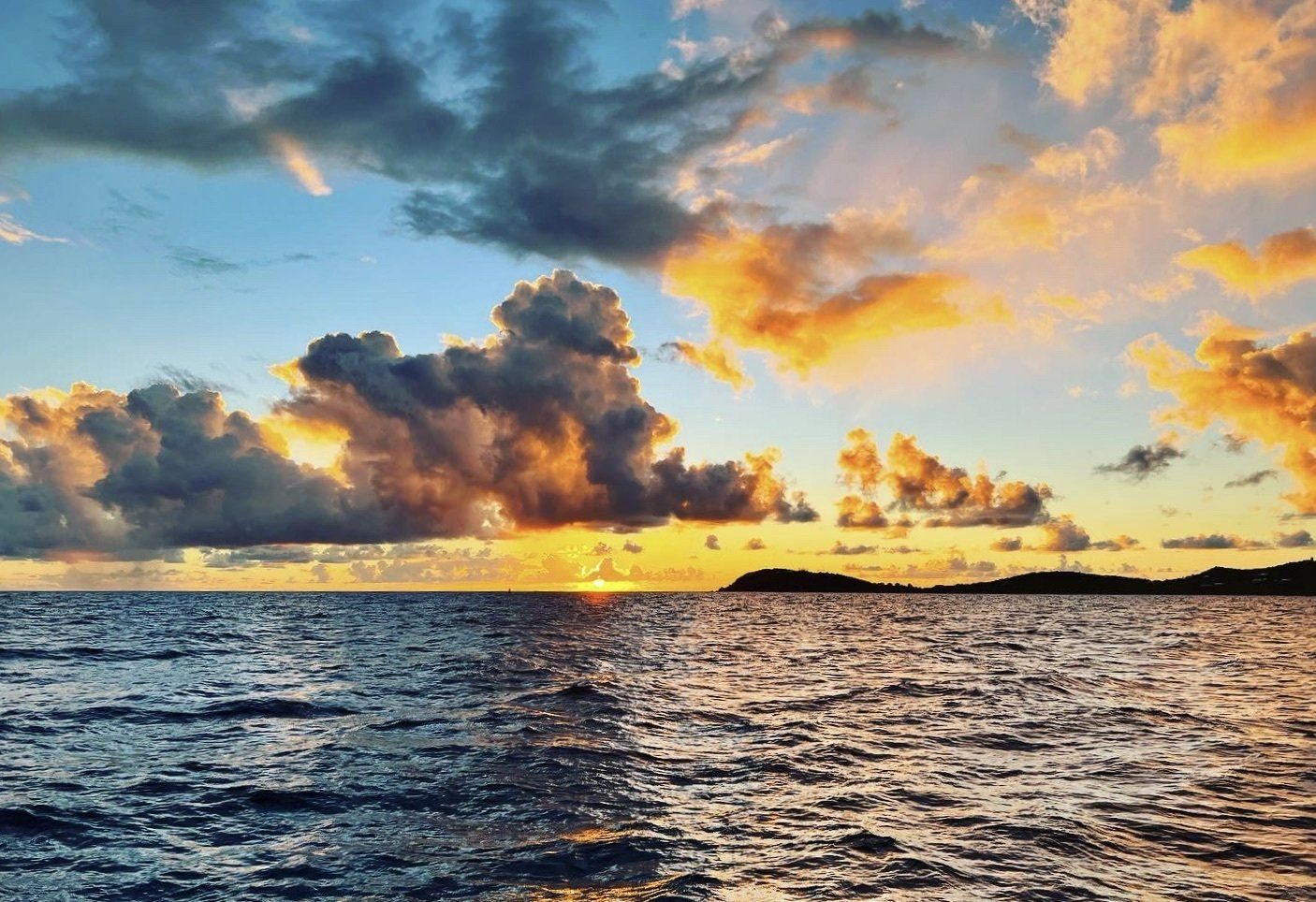 Sunset view in the ocean with beautiful clouds