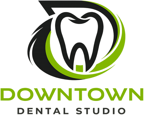 Downtown Dental Studio logo with stylized tooth in black, white, and green