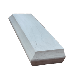 a long white piece of wood is sitting on a white surface .
