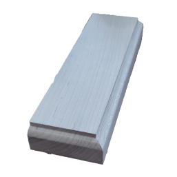 a white piece of wood is sitting on a white surface .