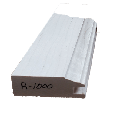 a white piece of wood with the number r-1000 written on it .