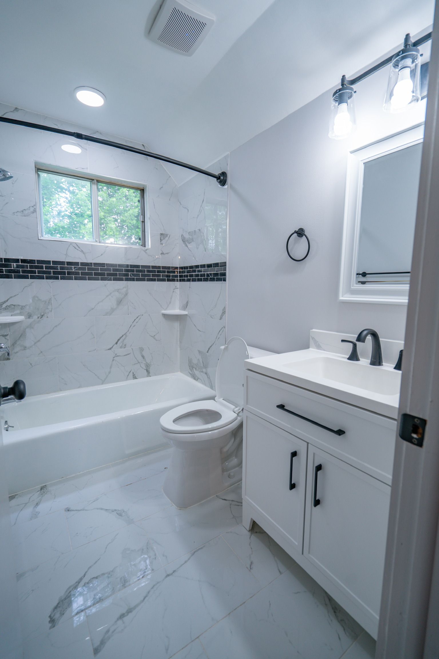 Photo of a bathroom with a tub/shower combo