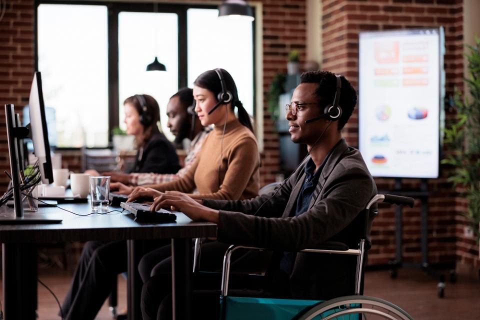 a disabled person on a call on a computer