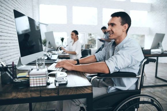 a disabled person working on a computer