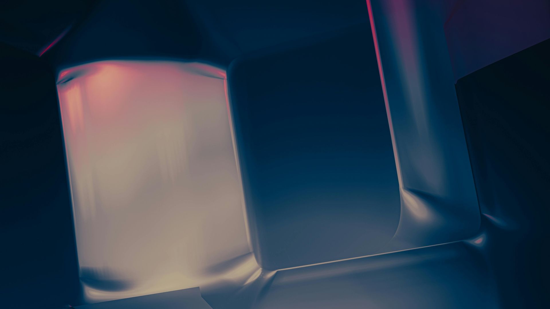 Dimly lit close-up of a frosted glass and dark blue interior surface with pink highlights