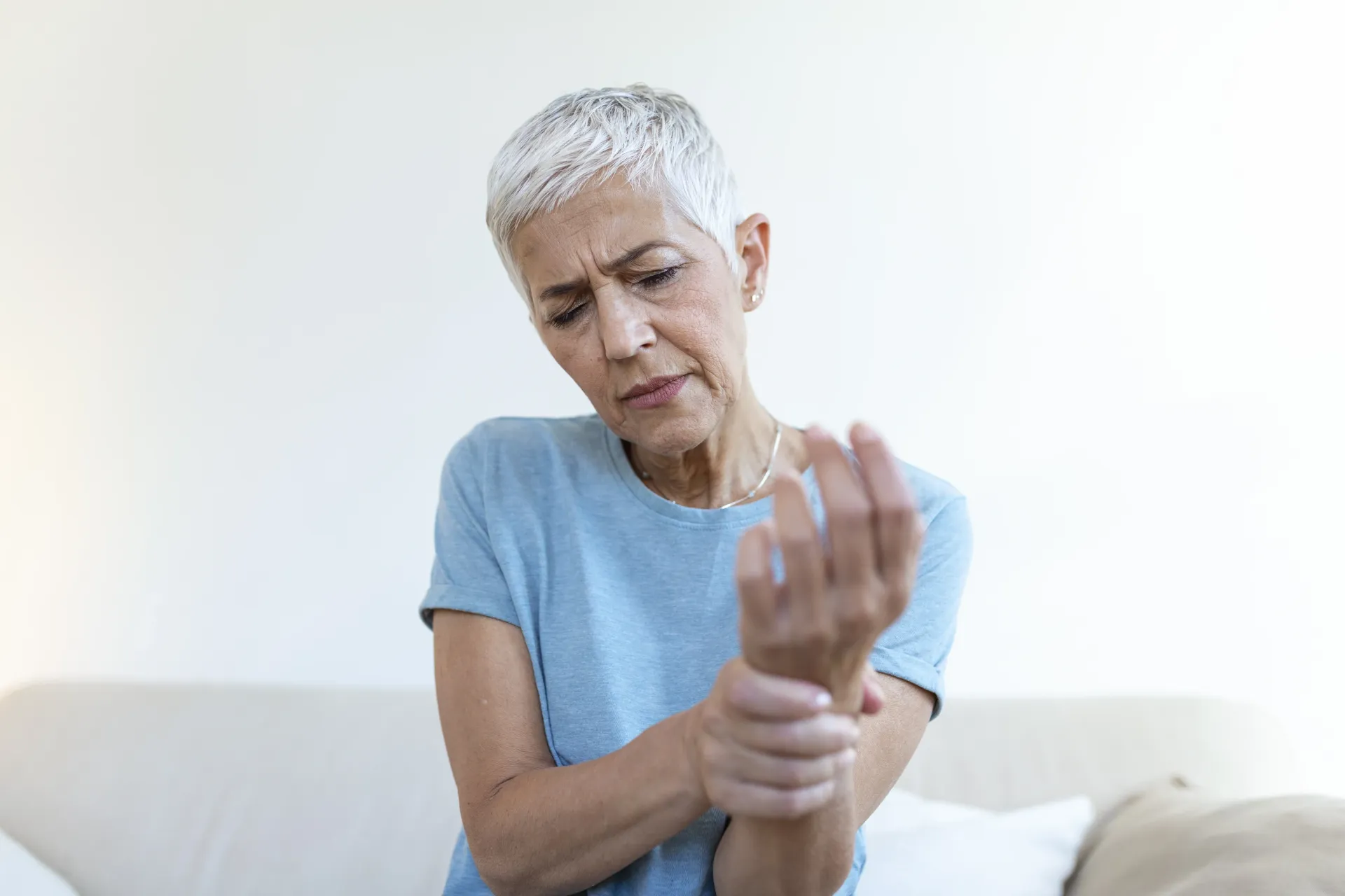 Senior Woman suffering from pain due to arthritis
