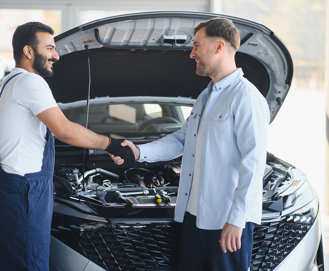 Mechanic welding under a car, bright sparks flying in a garage | A1 Brake & Service