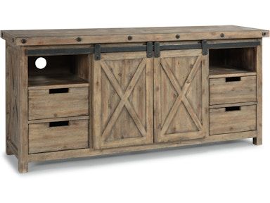 A wooden entertainment center with sliding barn doors and drawers.