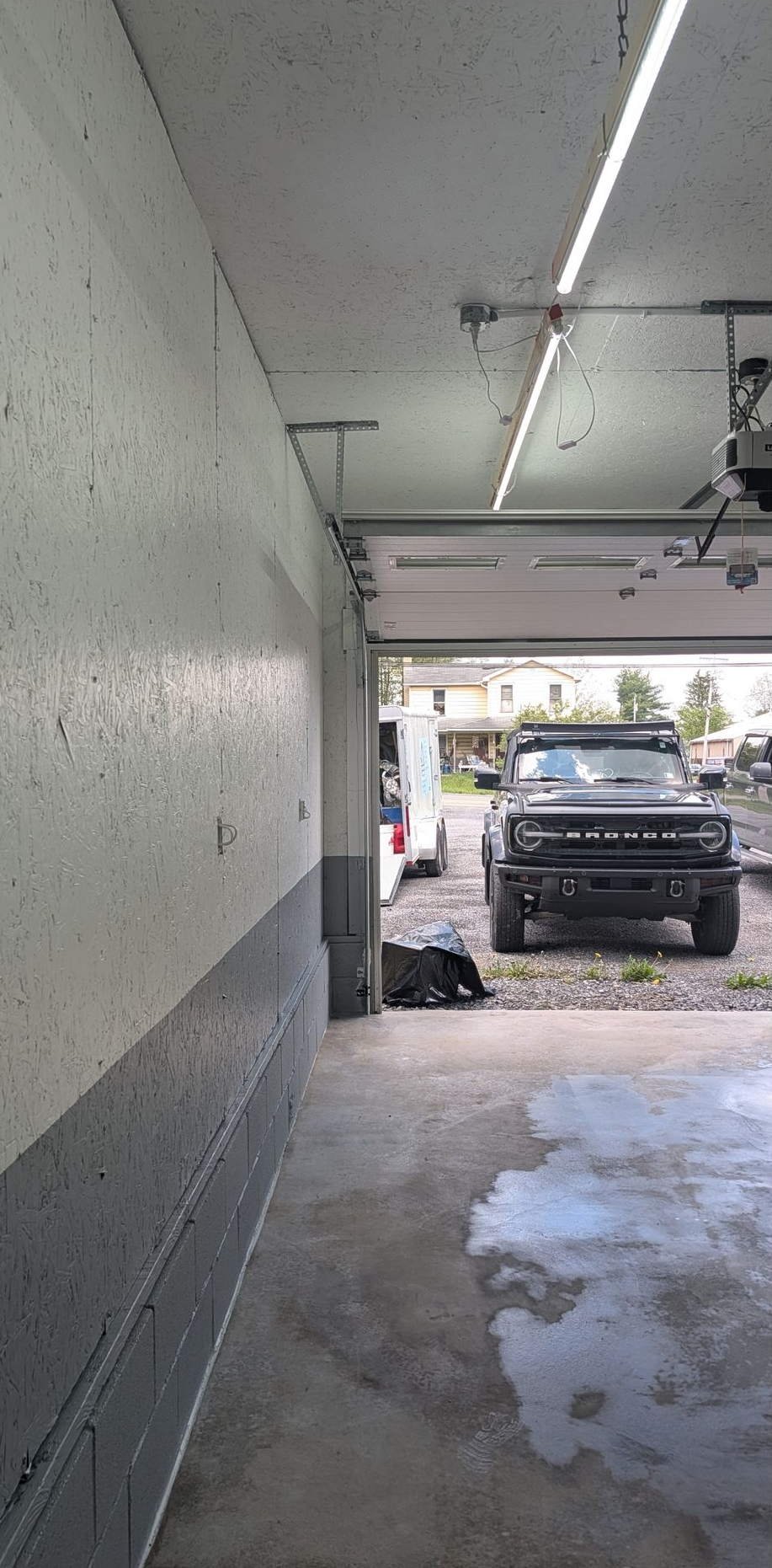 Shiny speckled epoxy floor in a bright room with open doors to a patio outside