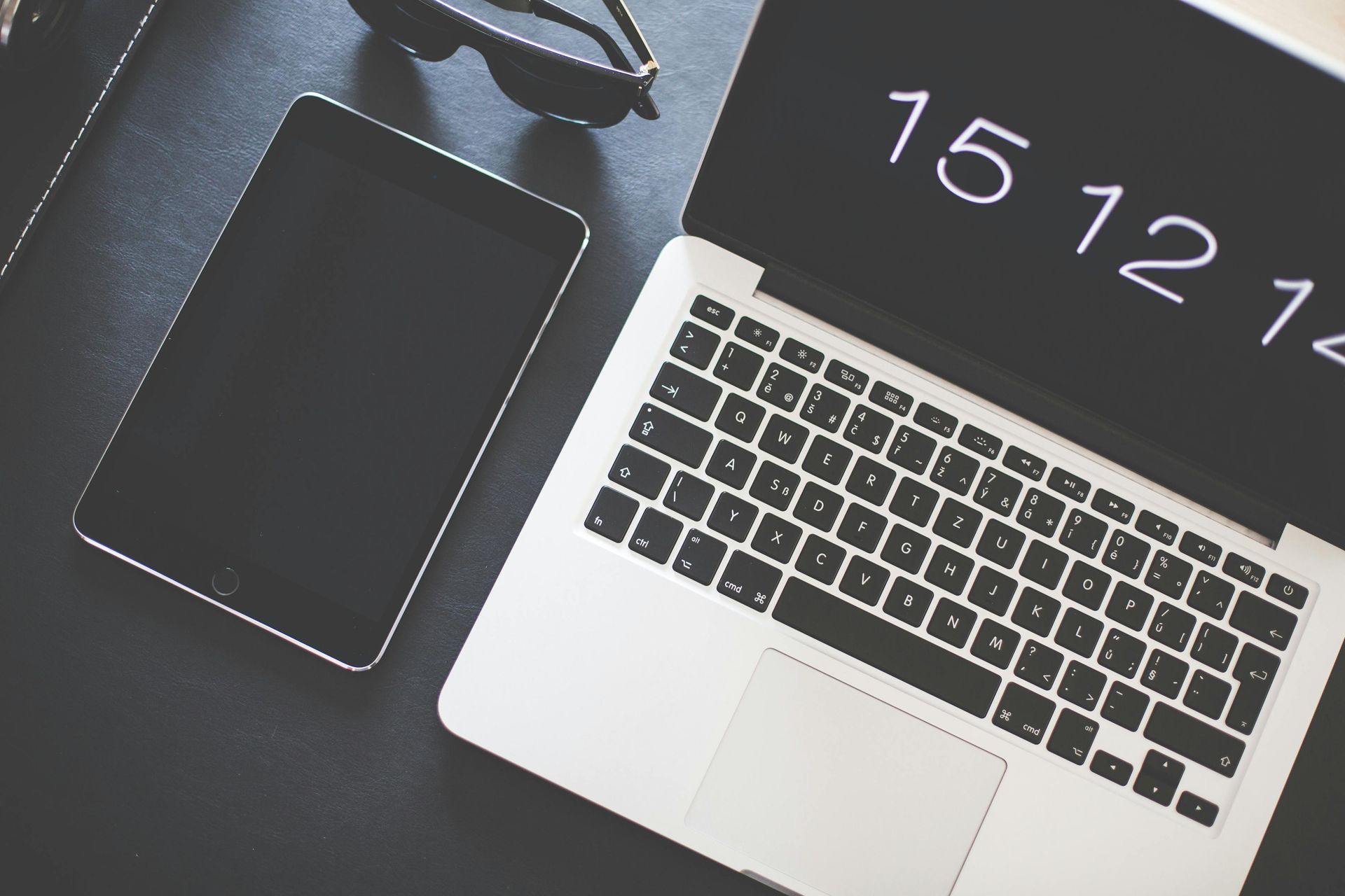 A laptop is open to a screen that says 15 12 12