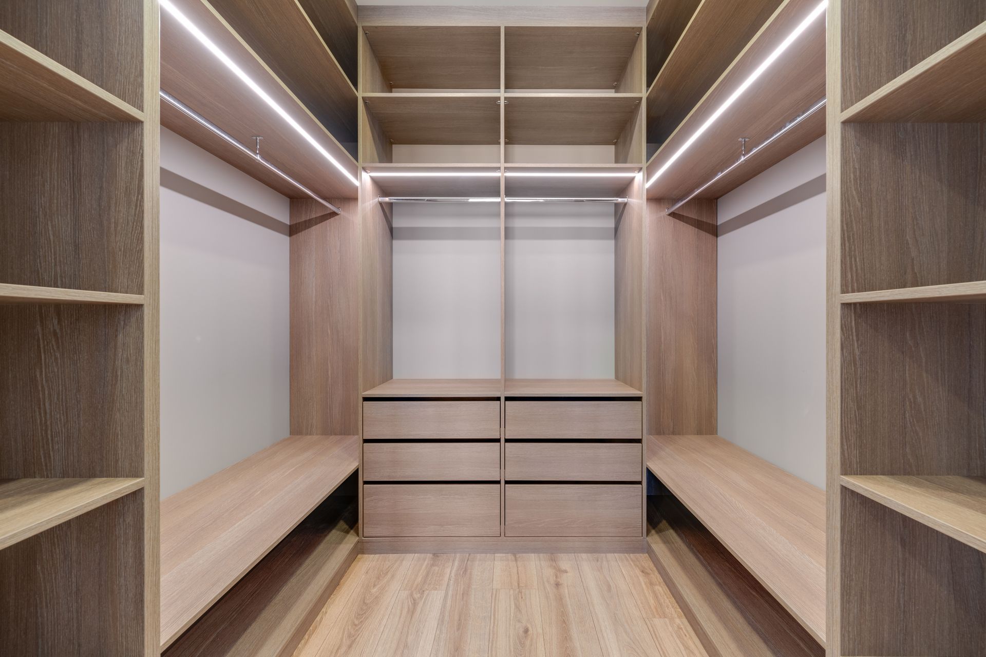 Modern luxury walk in closet with built in shelves