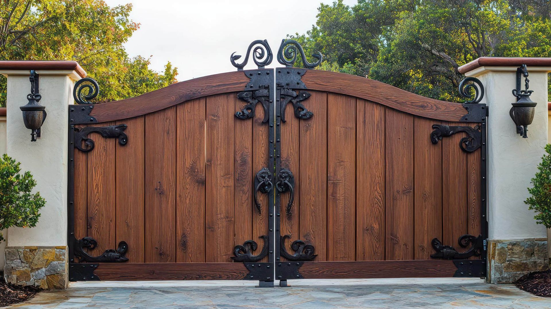 Wooden Gate with A Wrought Iron Fence Around It