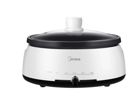 A white and black midea pot with a glass lid on a white background.
