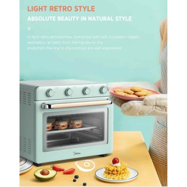 A mint green toaster oven with a copper handle on a white background.