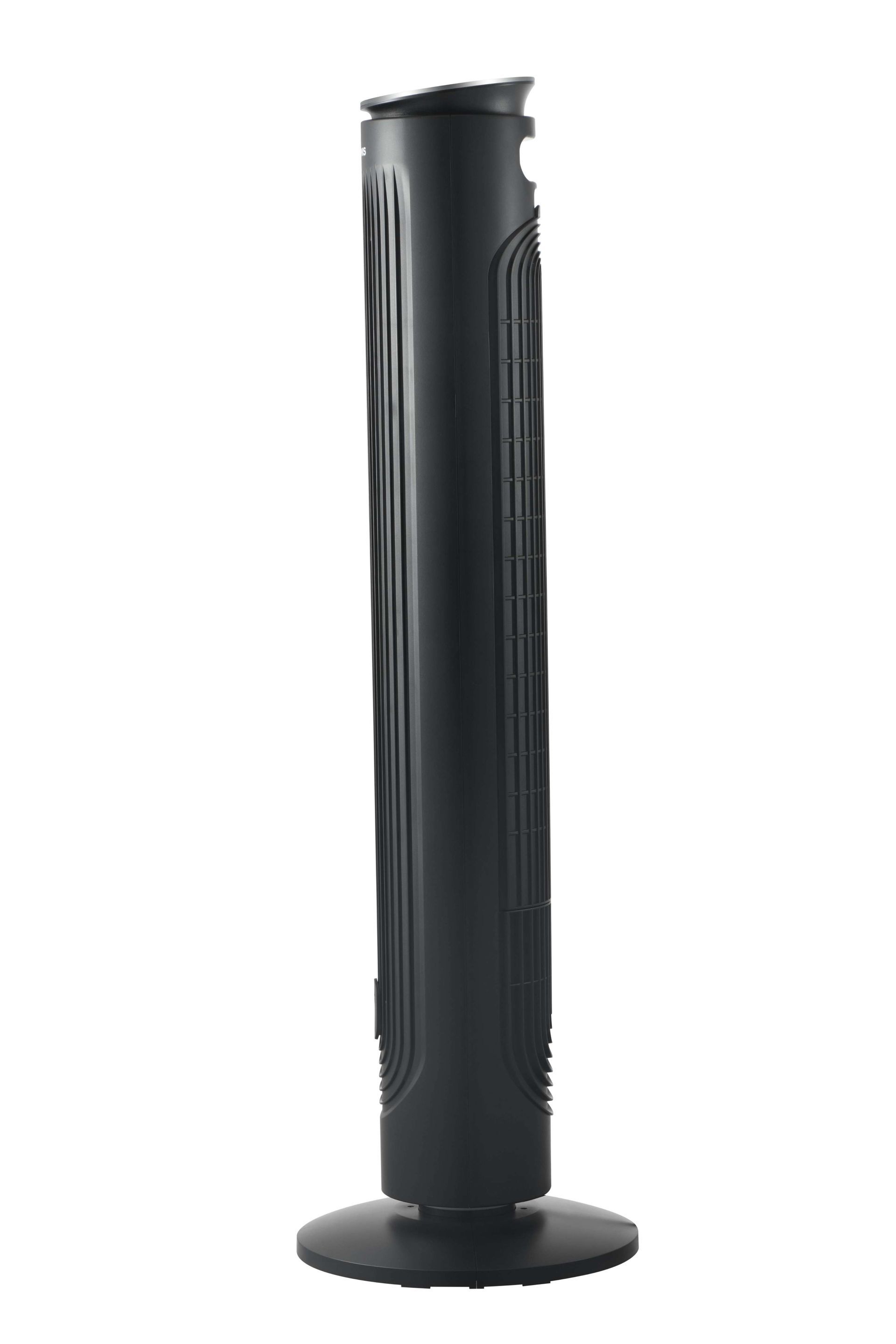 A black tower fan is sitting on a white surface.