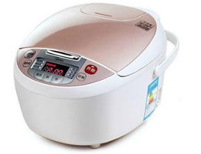 A white rice cooker with a pink lid is sitting on a white surface