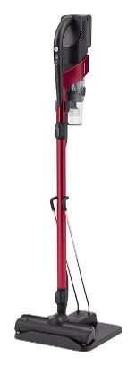 A red and black vacuum cleaner is sitting on top of a stand.
